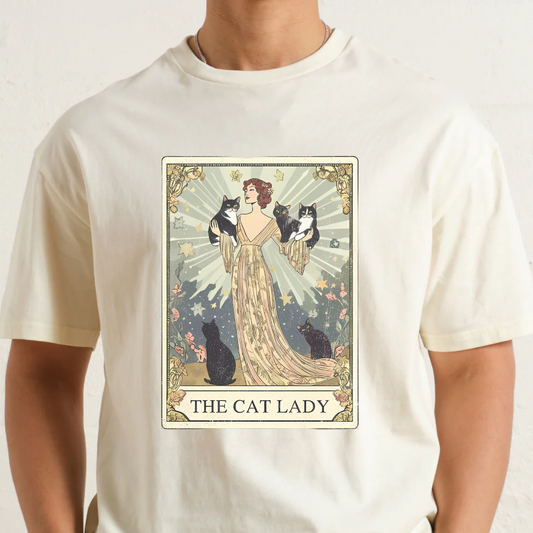 Natural t-shirt with 'The Cat Lady' graphic design featuring a woman and cats.