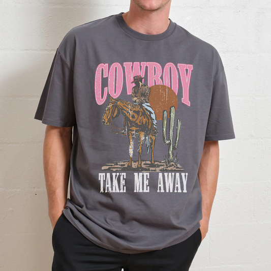 Person wearing a gray t-shirt with a cowboy graphic and text.