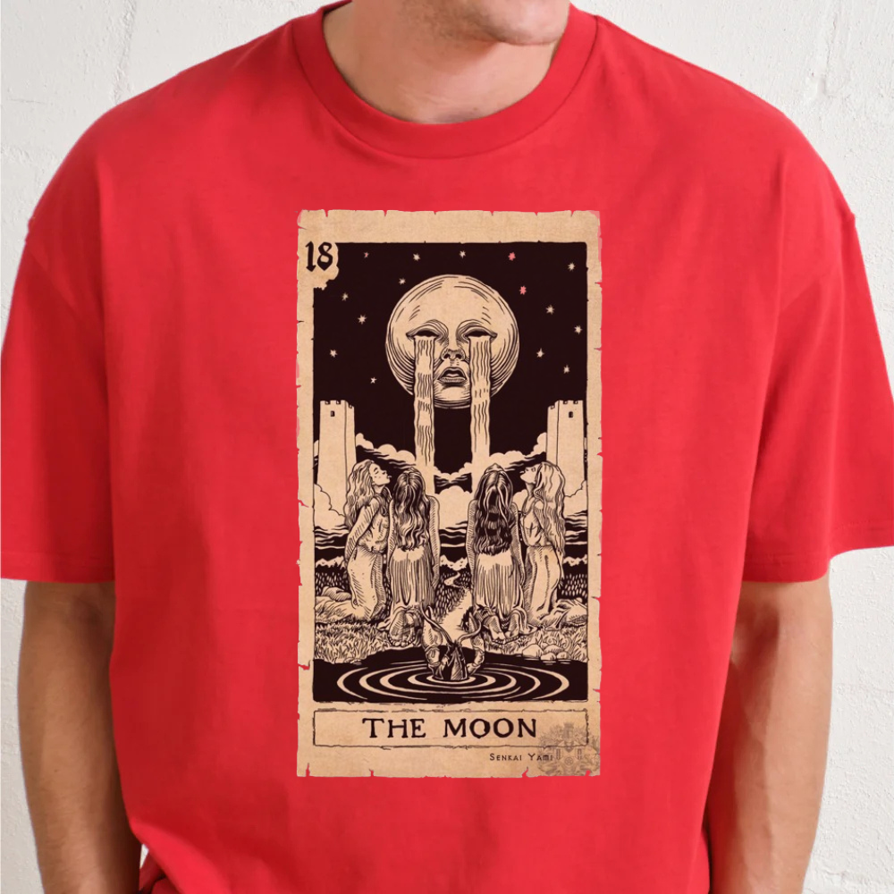 Red oversized graphic tee featuring 'The Moon' Tarot card illustration by Senkai Yami, unisex fit and ethically sourced.