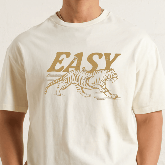 White t-shirt with a tiger graphic and 'EASY' text on a plain background