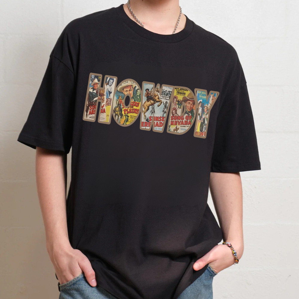 Person wearing a black t-shirt with graphic text design on a plain background