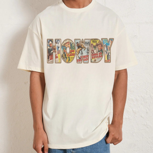 Person wearing a white t-shirt with a colorful graphic design on a plain background