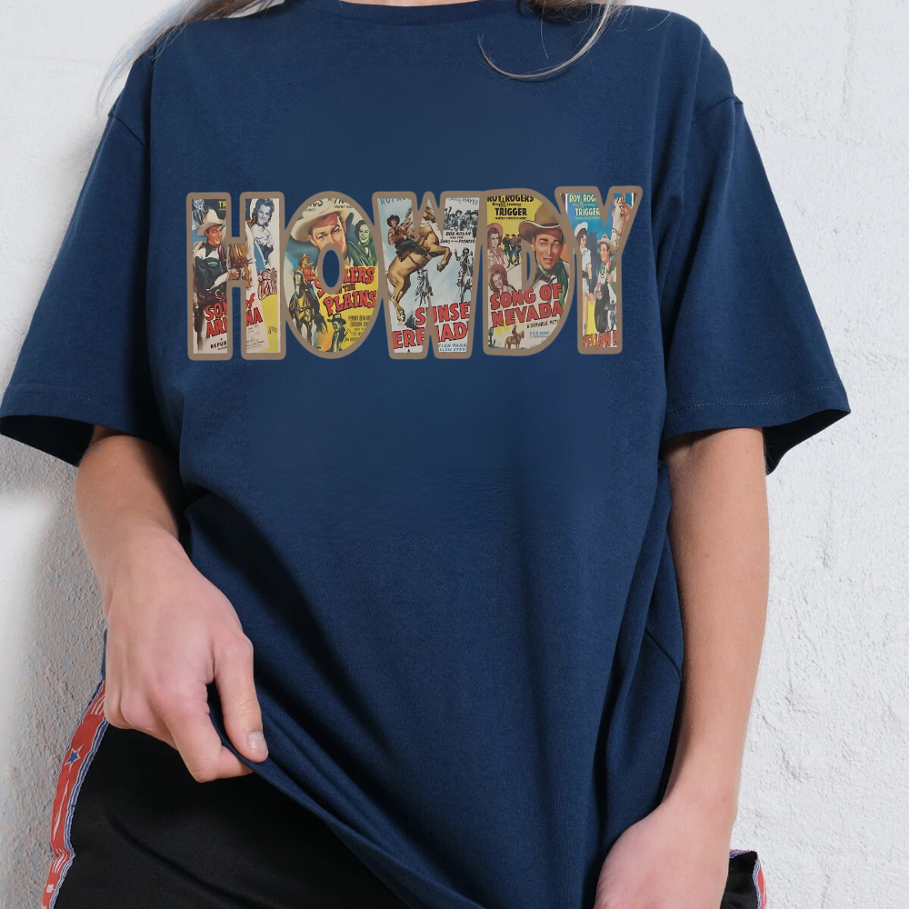 Navy blue t-shirt with 'Howdy' graphic design featuring vintage movie poster style text.