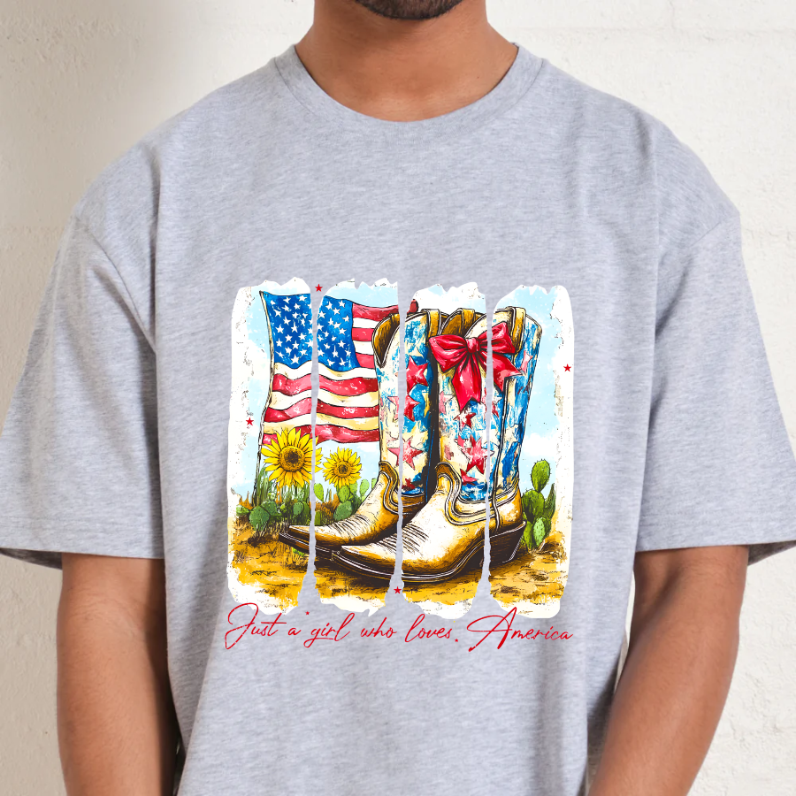 Gray t-shirt with a graphic of boots, an American flag, and cacti on a beige background