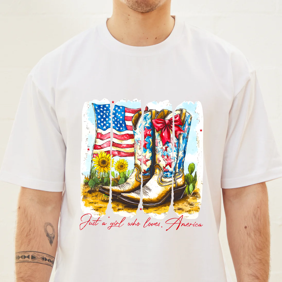 White t-shirt with a graphic of boots, American flag, and cactus on a plain background