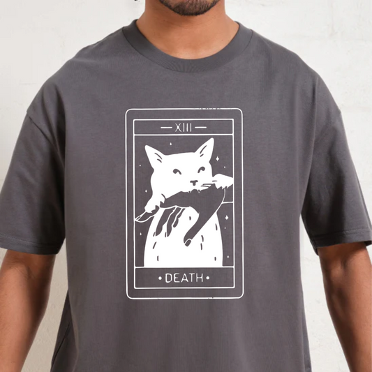 Person wearing a gray t-shirt with a graphic design of a cat and 'Death' card on a white background