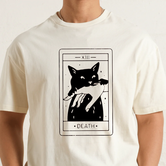 White t-shirt with a black cat and hand graphic on a beige background