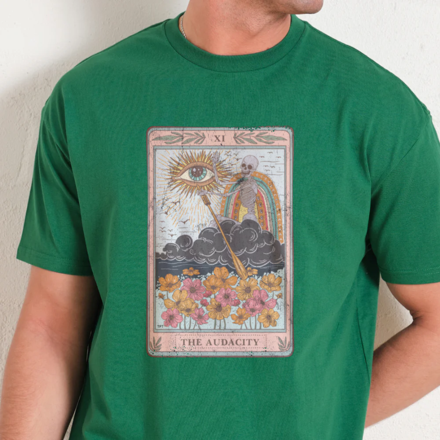 Green t-shirt with 'The Audacity' tarot card design worn by a person.