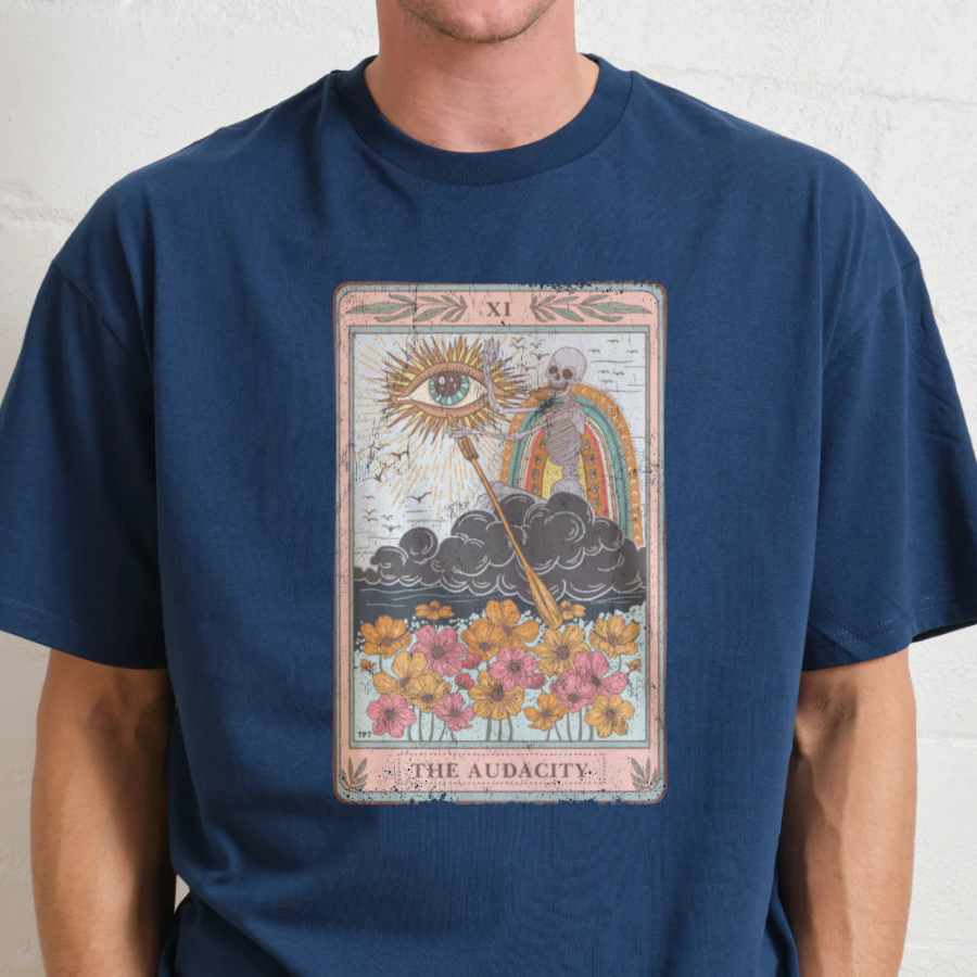Navy blue t-shirt with a tarot card design featuring an eye, skull, and rainbow on a plain background.