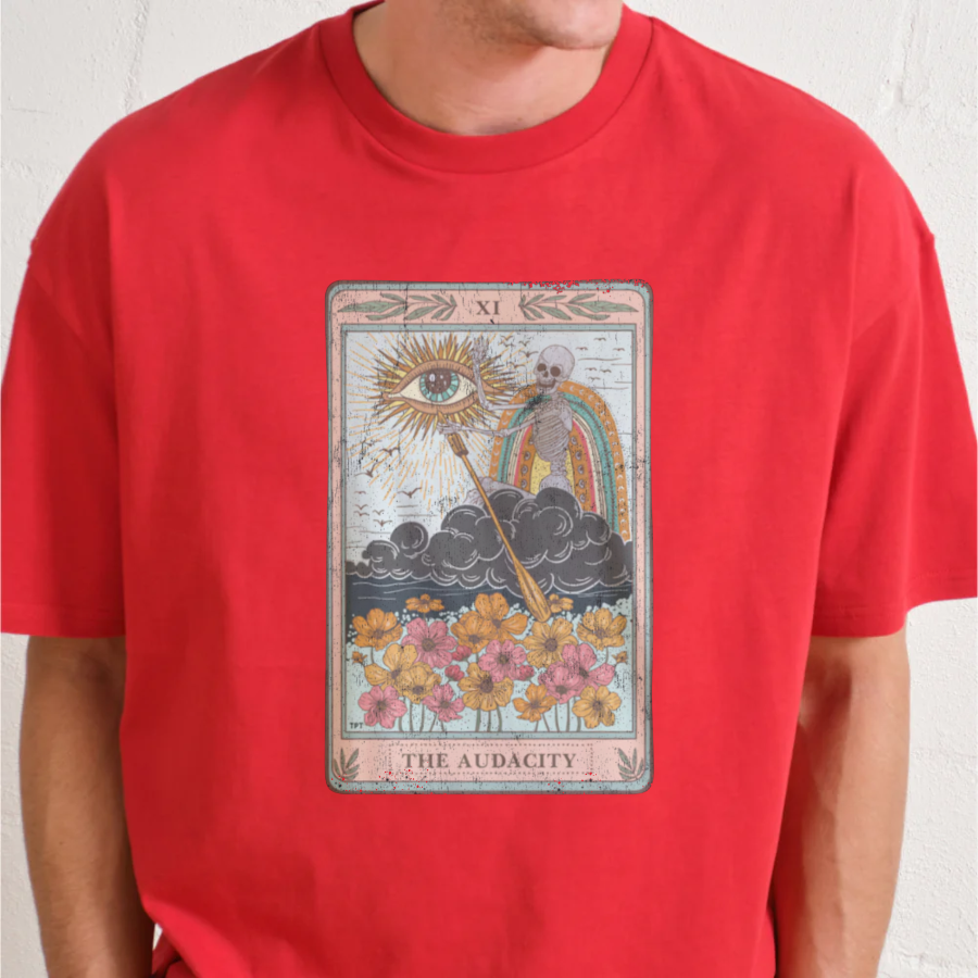 Red t-shirt with 'The Audacity' tarot card design worn by a person.