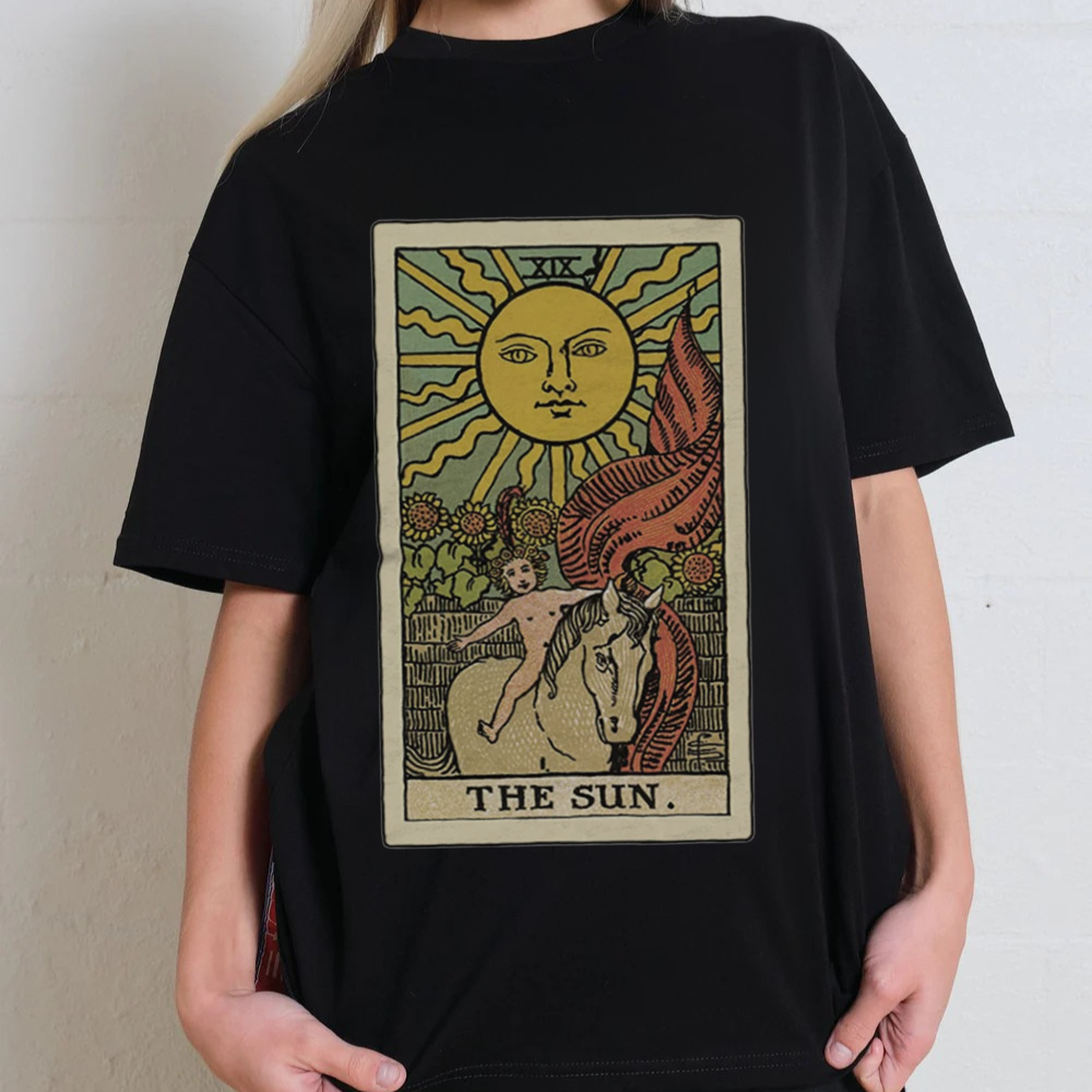 Black t-shirt with 'The Sun' tarot card design worn by a person