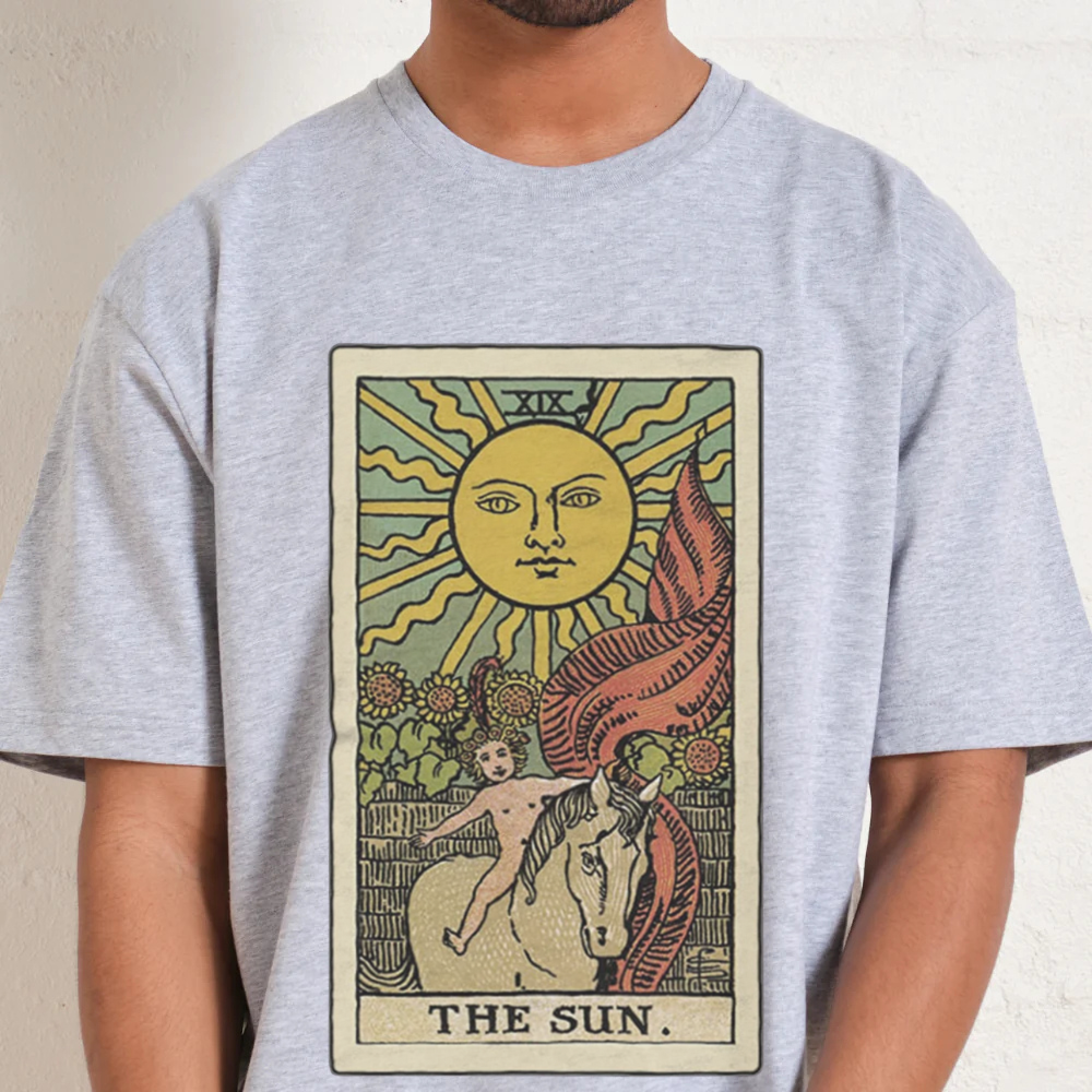 Person wearing a t-shirt with a tarot card design featuring 'The Sun'.