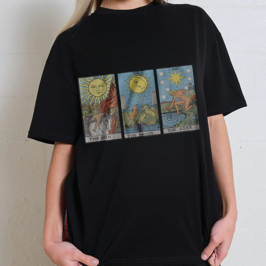 Black t-shirt with tarot card designs worn by a person against a neutral background