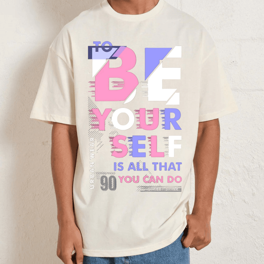 Unisex oversized graphic tee featuring 90s-inspired 'To Be Yourself' slogan lettering in colorful typography.