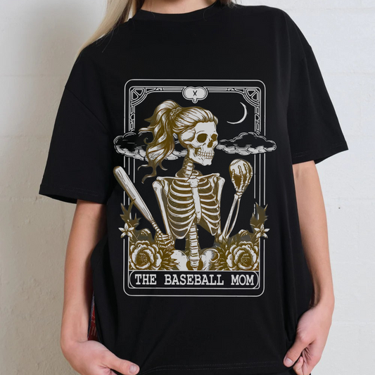 Black t-shirt with a skeleton holding a baseball bat and ball design, labeled 'The Baseball Mom'.