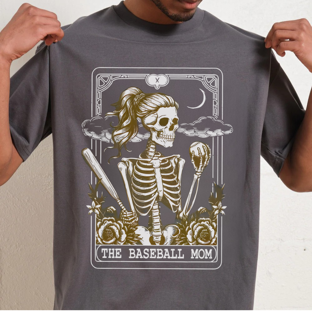 Person wearing a gray t-shirt with a skeleton graphic and 'The Baseball Mom' text.