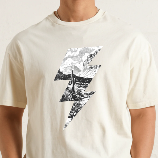 Natural t-shirt with black and white mountain graphic design on a plain background