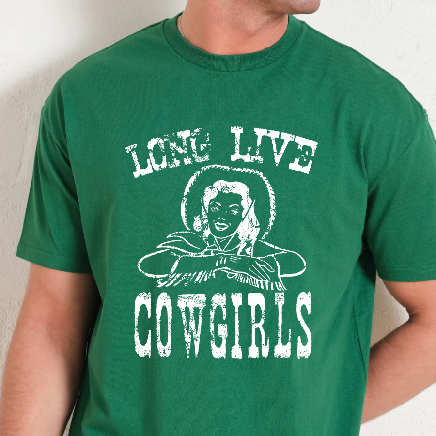 Green t-shirt with white graphic and text 'LONG LIVE COWGIRLS' worn by a person.