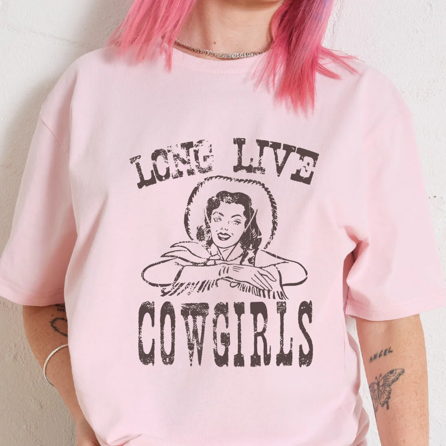 Pink t-shirt with 'Long Live Cowgirls' graphic and person with pink hair