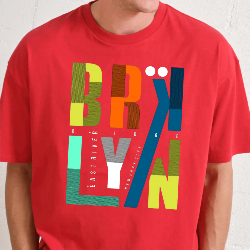Red t-shirt with colorful 'Brooklyn' graphic design on a plain background