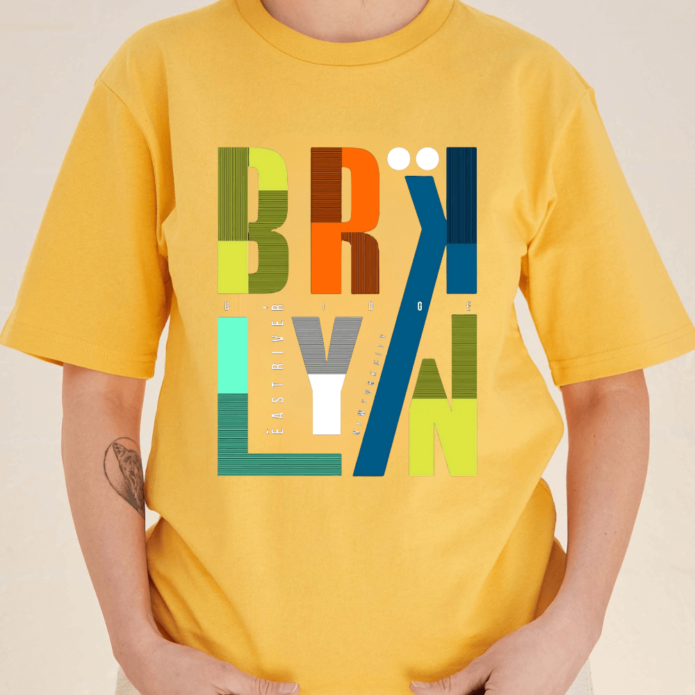 Yellow t-shirt with colorful 'BROLYAN' design on a plain background