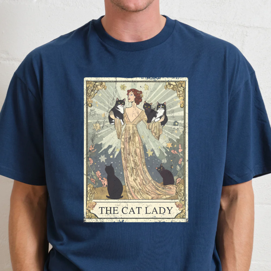 Navy blue t-shirt with 'The Cat Lady' graphic design featuring a woman and cats.