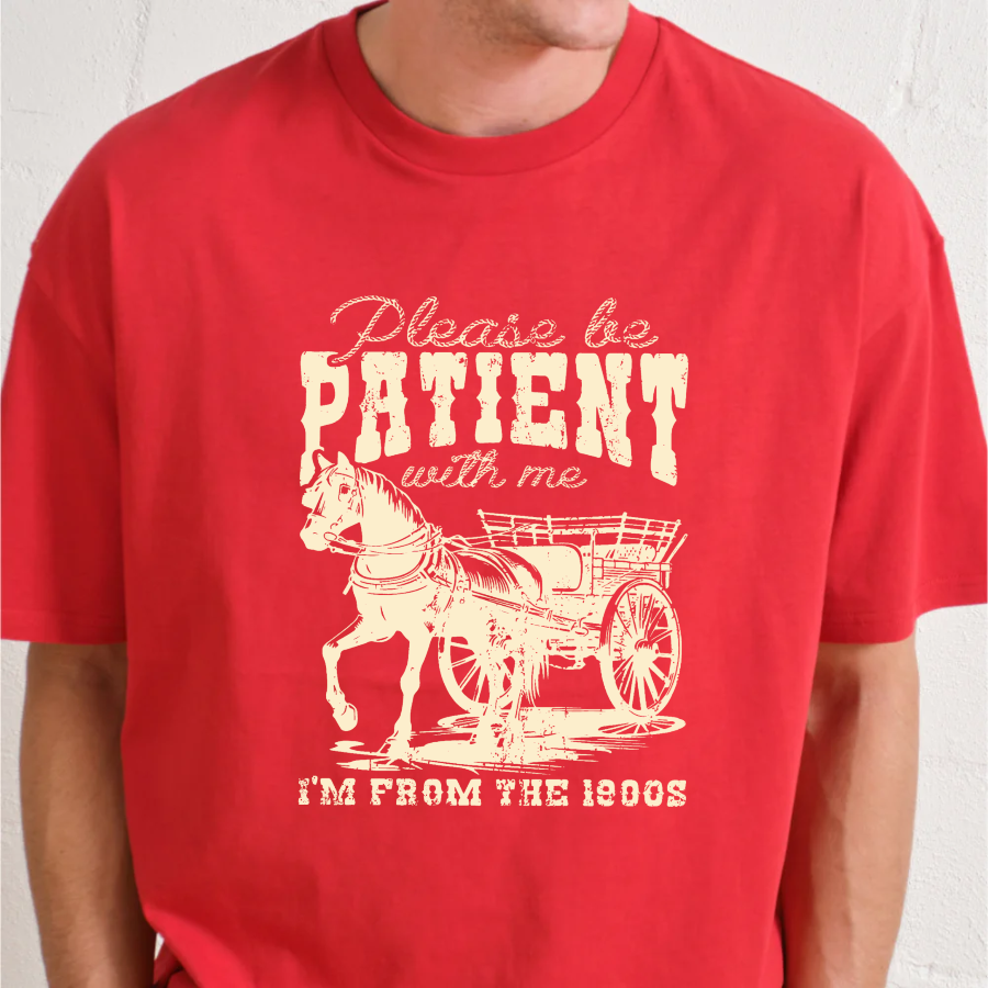 Red t-shirt with a graphic of a horse and cart and text on a white background