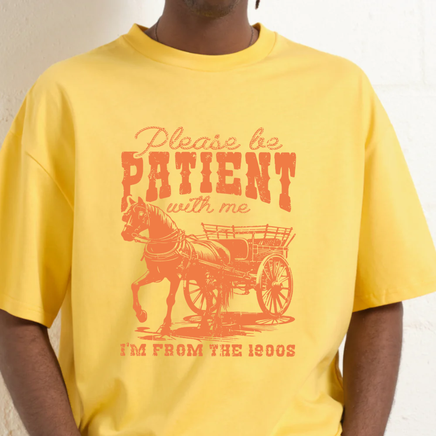 Yellow t-shirt with a horse and carriage graphic and text on a white background