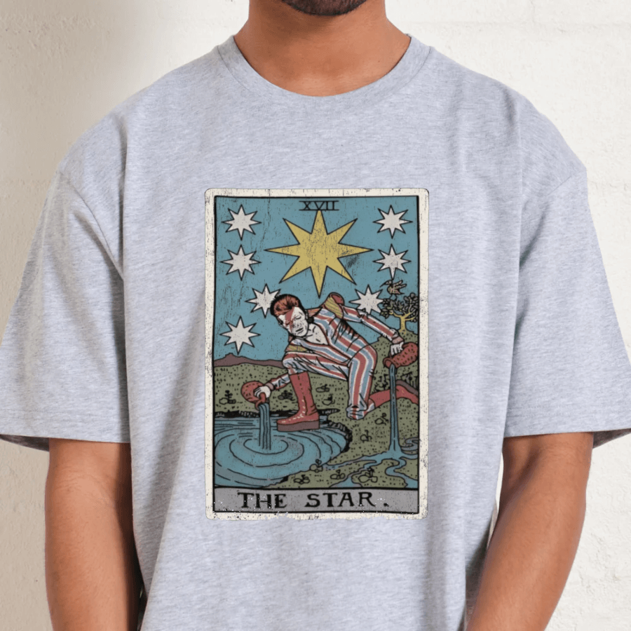 Person wearing a gray t-shirt with 'The Star' tarot card design.