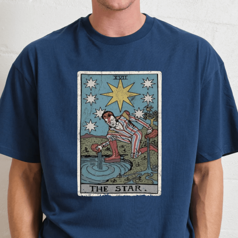 Person wearing a blue t-shirt with 'The Star' tarot card design.