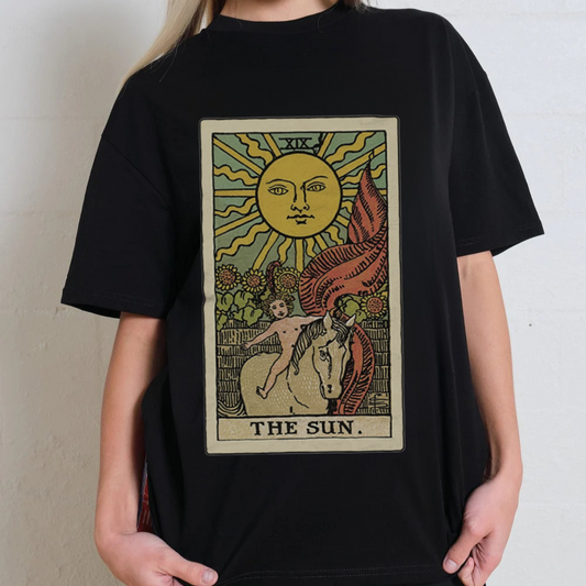 Black t-shirt with 'The Sun' tarot card design worn by a person