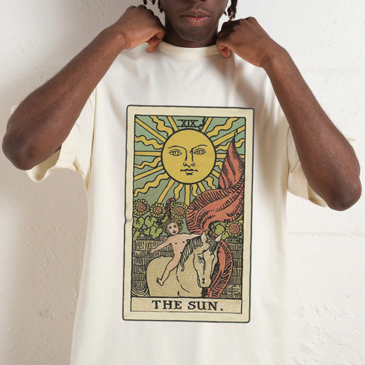 Person wearing a white t-shirt with a black skeleton design and text.