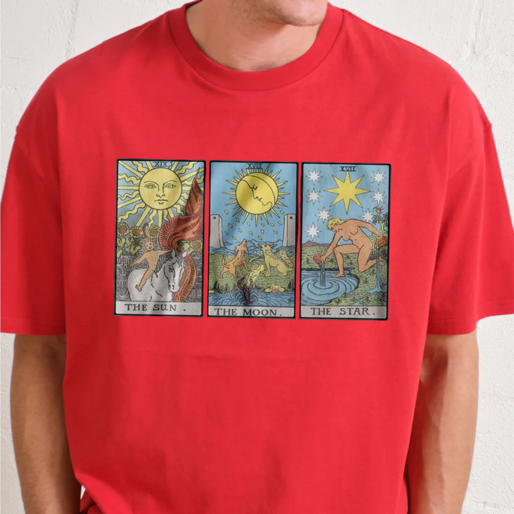 Red t-shirt with tarot card designs on a plain background