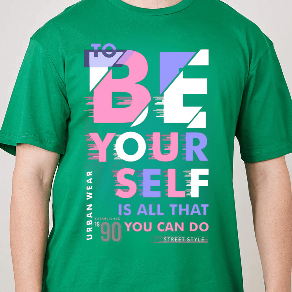 Green t-shirt with motivational quote in colorful letters on a plain background