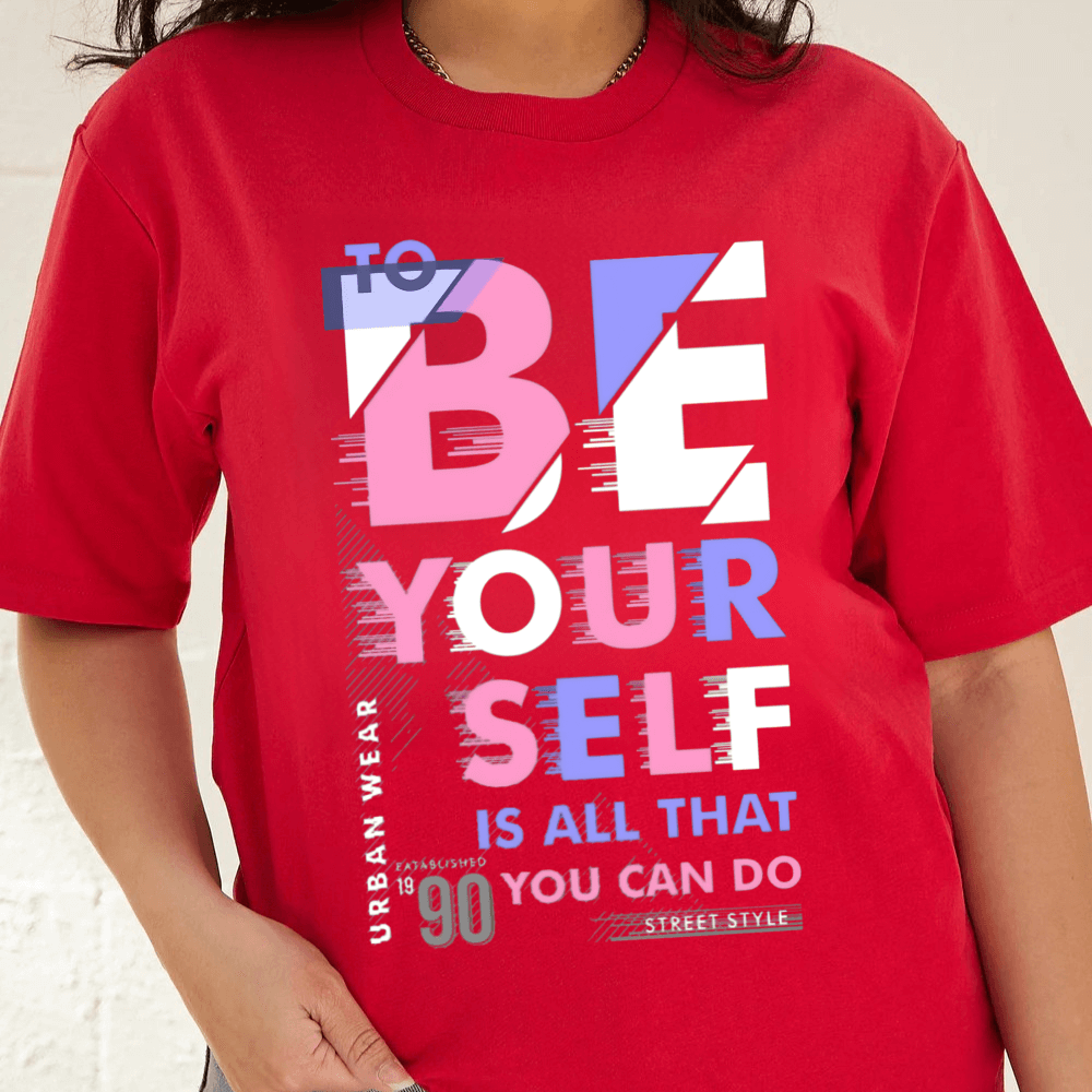 Red t-shirt with motivational text design on a plain background