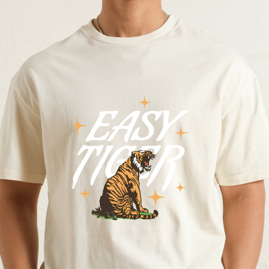 Natural t-shirt with a tiger graphic and 'Easy Tiger' text on a plain background