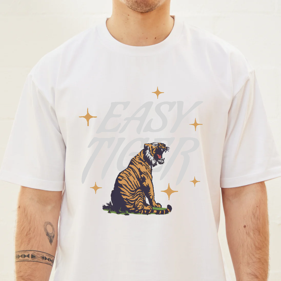 White t-shirt with a tiger graphic and 'Easy' text on a plain background